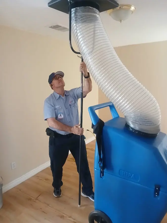 Furnace Tune-Up technician using HEPA equipment in Fairfield Glade